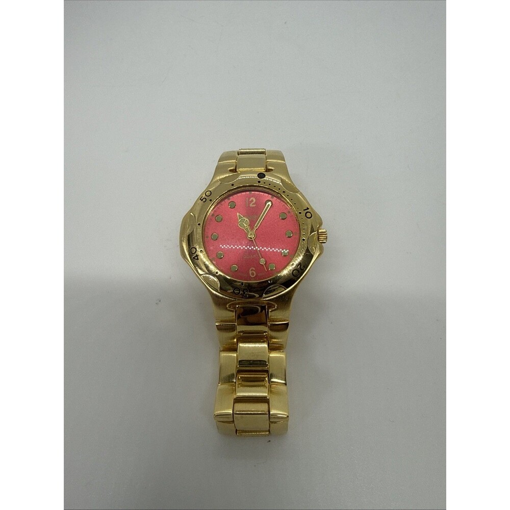 Geneva Women’s Watch Red Dials Gold Bezel Gold Bracelet